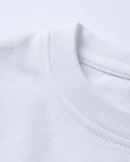 Image 2: Bio-washed 180 GSM white engineered cotton fabric macro closeup — THE OUR STORE