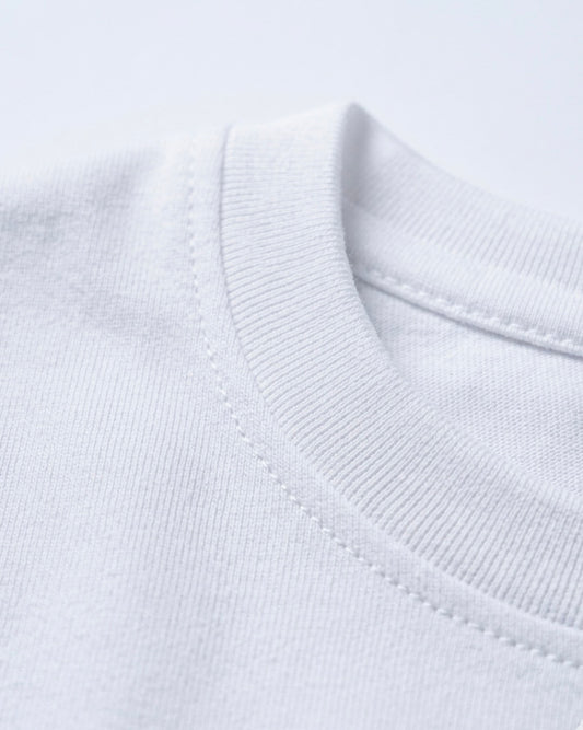Image 2: Bio-washed 180 GSM white engineered cotton fabric macro closeup — THE OUR STORE