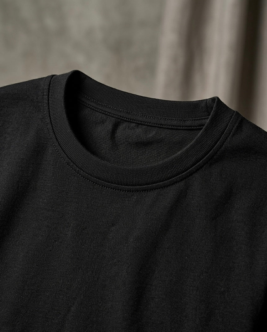Image 2: High-density ribbed crewneck collar on 220 GSM black oversized t-shirt — THE OUR STORE
